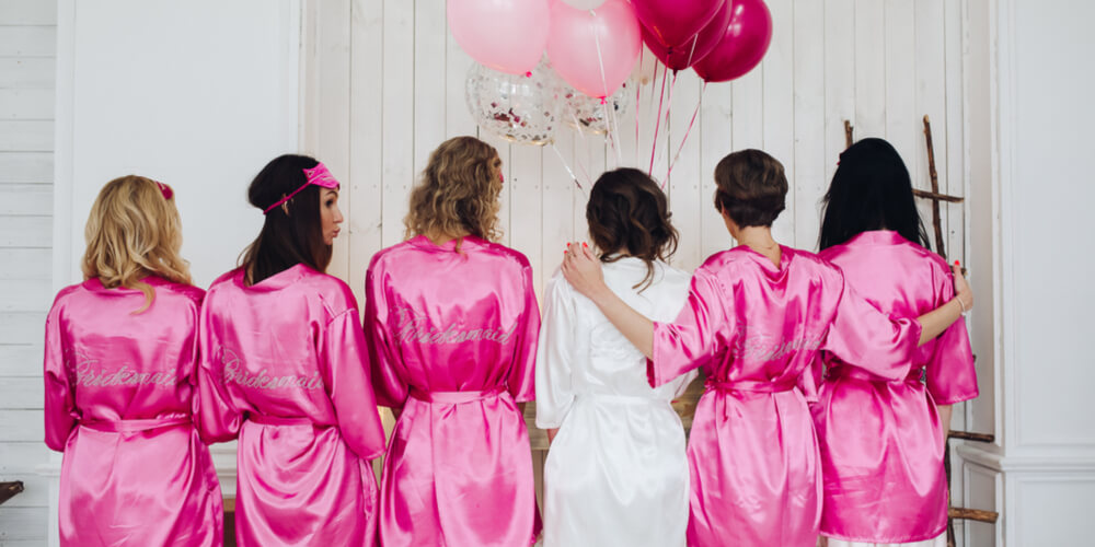 women on bachelorette party in matching pyjamas/robes