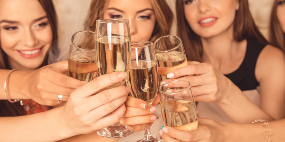 Women clinking champagne glasses